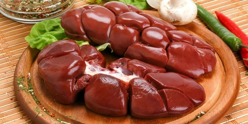 Fresh organ meats on a plate as a natural source of protein and organ meats for dogs