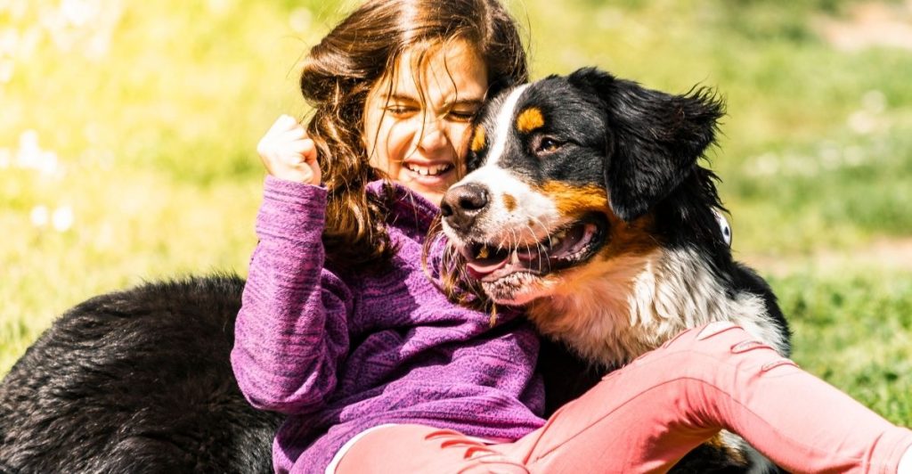A dog and a human standing side by side showing their unbreakable bond