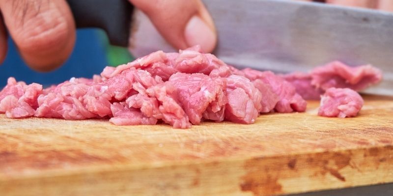 Fresh ingredients in a kitchen for a dog as the only safe alternative the dog food industry does not offer