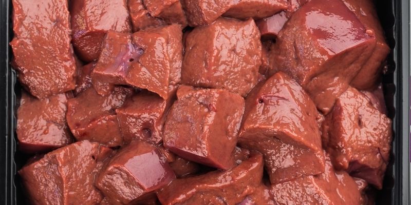 A close up of chopped organ meat rich in vitamins to express pureloveandharmony and ancestral dog health