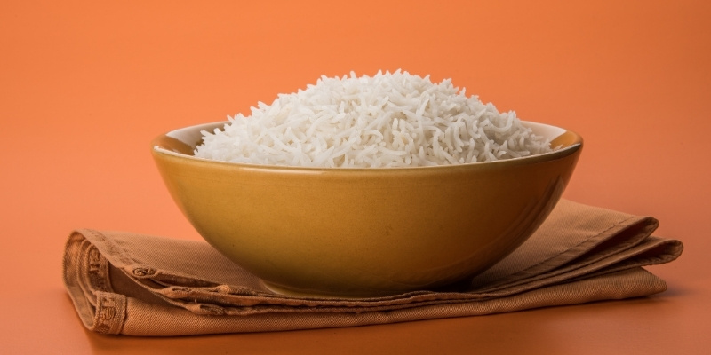Bowl of white cooked rice illustrating high starch carbohydrates in a dog's diet